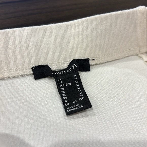 NWT Forever21 white bodycon mini skirt with peplum ruffle trim (M) - Picture 4 of 5